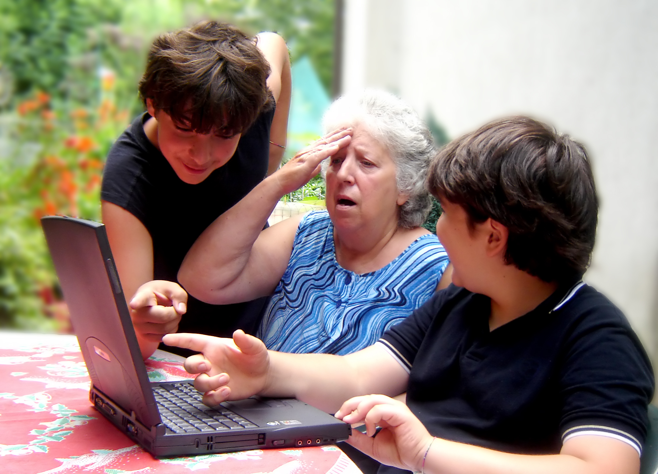 old lady with your children at computer
