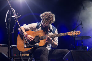 man playing guitar as a life goal